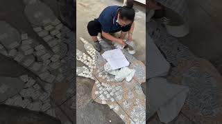 Red and gray granite dragon claw-shaped mosaics in the stone factory for an exciting new project