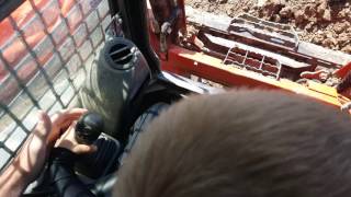 Lucas running a skid loader