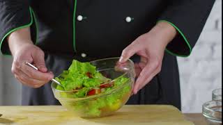 Tossing of vegetable salad slowmo