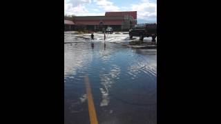 Boys play in the rain water at Maceys