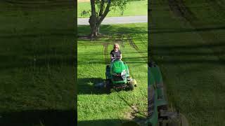 Wife mowing the lawn while it's still wet