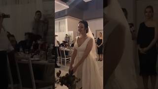 the bride throws her wedding bouquet