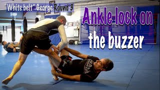 Ankle locking a white belt at the buzzer