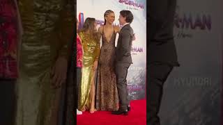 Tom Holland Blocks The Press To Let Zendaya Fix Her Dress | Celebrity Moments #Shorts #Tomholland