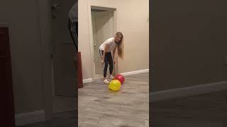 Tanya brings red nd yellow balloons to the doggie