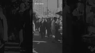 People walking on the sidewalk, Japan, late 1940s