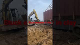 Pulling out stuck excavator extremely slimey stick clay