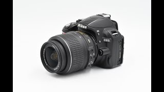 Обзор боковой части зеркальной фотокамеры Nikon D3100