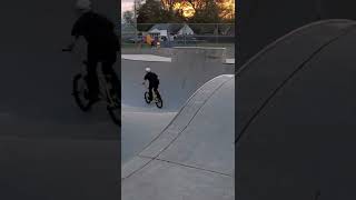 bmx ripping around the bowl to backflip