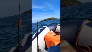 Wavy seas, inflatable boat fishing