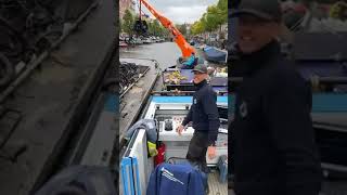 Cleaning the canals of Amsterdam