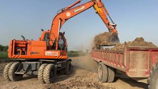 Hitachi Excavator Loading mud