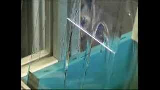 Laser Stripping of Glass Coating