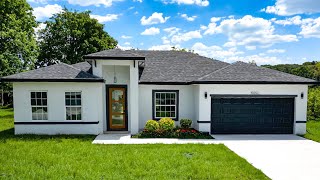 Inside a Brand New Home for sale on OVER HALF ACRE in Ocala, FL with NO HOA!