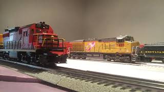 Lionel GP38 and MTH ES44AC departing