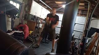 Tough 3 Minutes - Rogue Bike Sprint 30 Seconds 100 - 50 LB One Hand Kettlebell Swings.