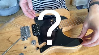 Taking the scratchplate off my Charvel for the first time.... What's underneath?!