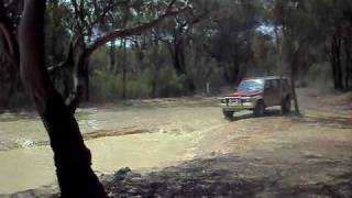 nissan patrol with 33s in water hole