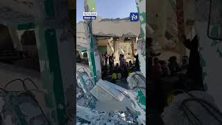 Children study on the rubble of a school destroyed in Khan Younis