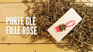 Porte-clé rose en forme de petite fille