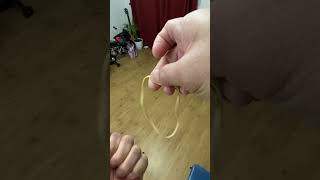 RUBBER BAND THRU FINGERS