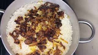 Raisins,gratedcarrots,onions in soy sauce on white rice.@viollahsdiary