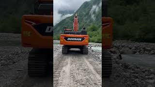 Walking behind the giant #doosan #excavator #river #giant