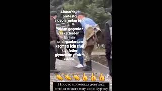 Almatı'daki protesto videolarından biri. kaçması için sivil kıyafetler giymesine yardım ediliyor