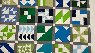 Pin basting the blue and green and white quilt tutorial