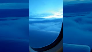 Plane flying in heavy clouds | Sunrise in clouds | Beautiful view from plane window | Blue clouds