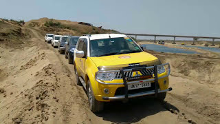 Mitsubishi Pajero Sport going off-road to reach the bed of Sone River