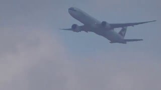 Cathay Pacific Boeing 777-300ER windy takeoff from JFK airport