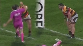 Rugby player pushes off Referee