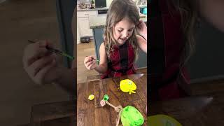 Skye paints apple ornaments 🍎 🍏