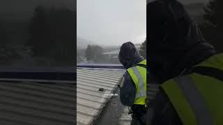 Wild roofing weather! #shorts #roof #roofer #roofing #roofershelper #metalroof #commercialroofing