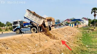 Starting New Project, Dump Truck Unloading Soil & Stone Filling Up The Land And Bulldozer Pushing