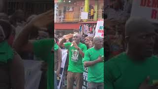 Nigeria protesters sing old national anthem to spite their president, Tinubu's failing government.