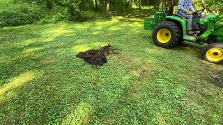 John Deere 3038E Tackles Small Stump with Grapple Attachment