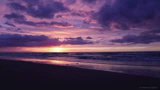 Sunset by the North Sea beach of Oostende. Beautiful sunset and sea waves in Oostende