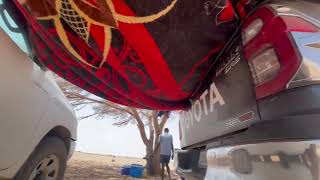 Creating a better rest spot with more shade during a stop in the Sahara Desert in Mauritania.