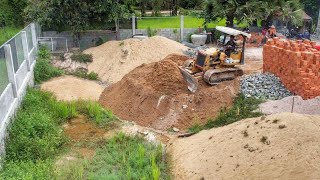 Preparing clearing out grass in water by Bulldozer D20 Push soil drop down