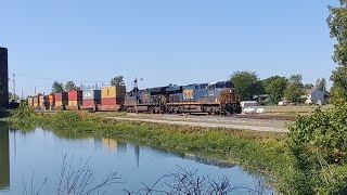 Slow stack train runs through Deshler Ohio next to old B&O signals.