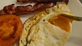 Aussie Breakfast Crispy Maple Bacon fried eggs and grilled tomato on sour dough