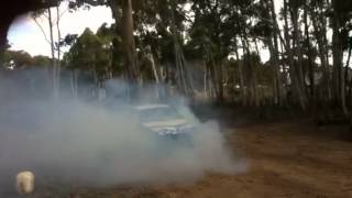 Holden commodore VN paddock basher burnout blows tyres bush