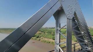 Crossing the Narmada River in the state of Gujarat on the Western Railway & train doors wide open!