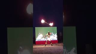 Professional Circus artist uses different props during an incredible fire performance!