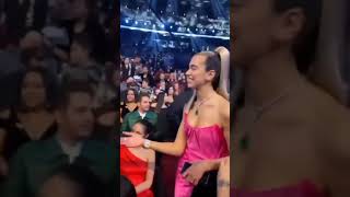 Billie Eilish and Dua Lipa hugging on Grammy Awards