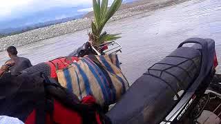 Crossing over Noa-Dihing RIver on a wooden boat