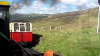 Locomotive No 3 "Wyddfa" passing a down train during an ascent up Snowdon