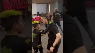 Young mixed martial artists practicing striking, footwork, and blocking